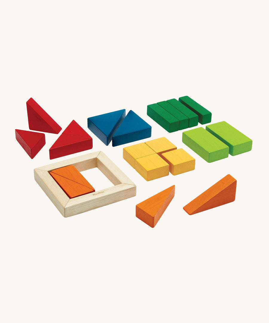 PlanToys children's wooden fraction blocks maths learning set laid out on a cream background. The block colours are red, blue, dark green, light green, yellow, and orange