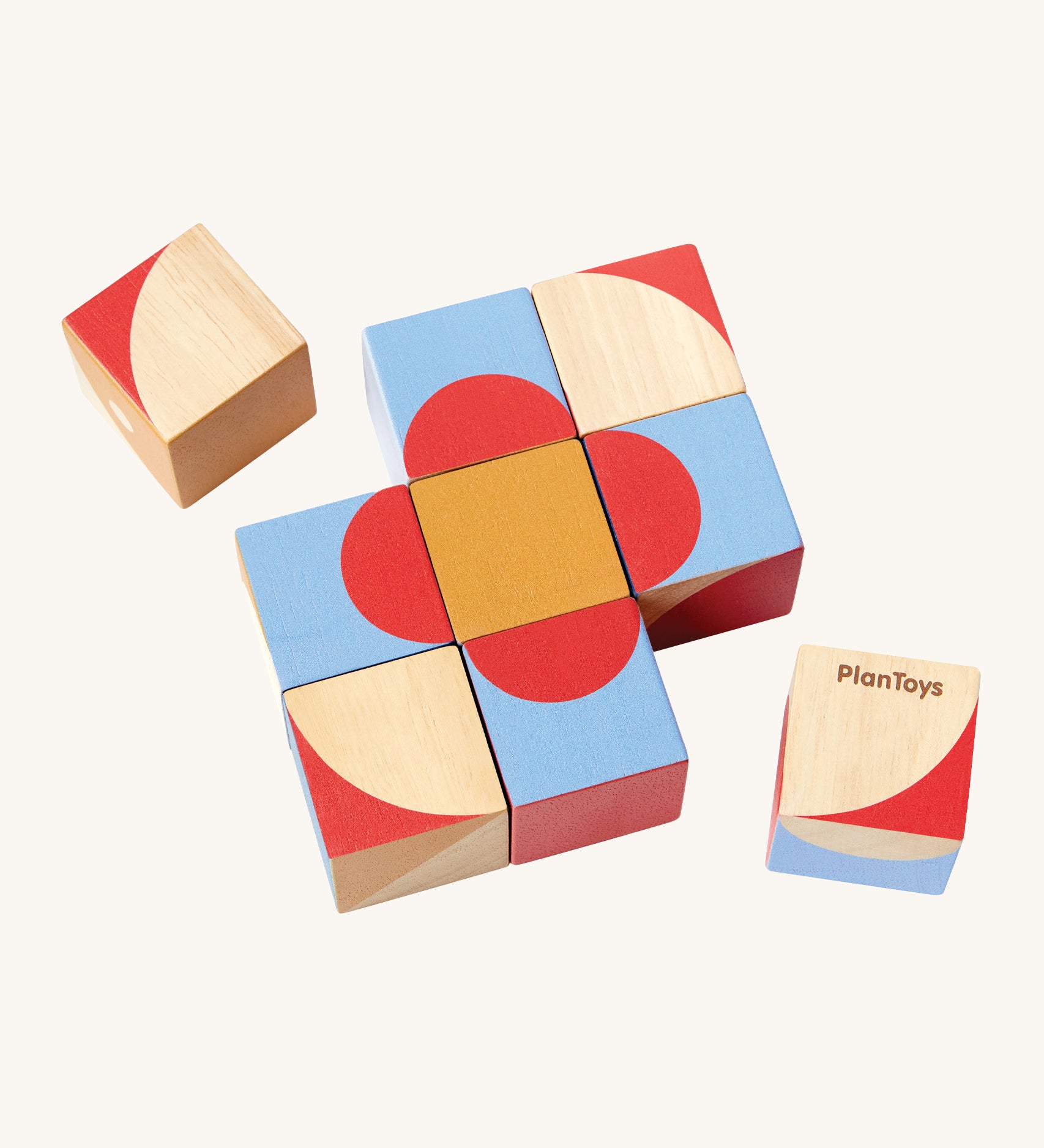 The PlanToys Geo Pattern Cubes are a fantastic STEM toy for children. The image shows 3 cubes each with a geometric petterns in the colours red, blue, orange, white and natural wood. The images shows 7 blocks together in the center with a block either side, on a cream background