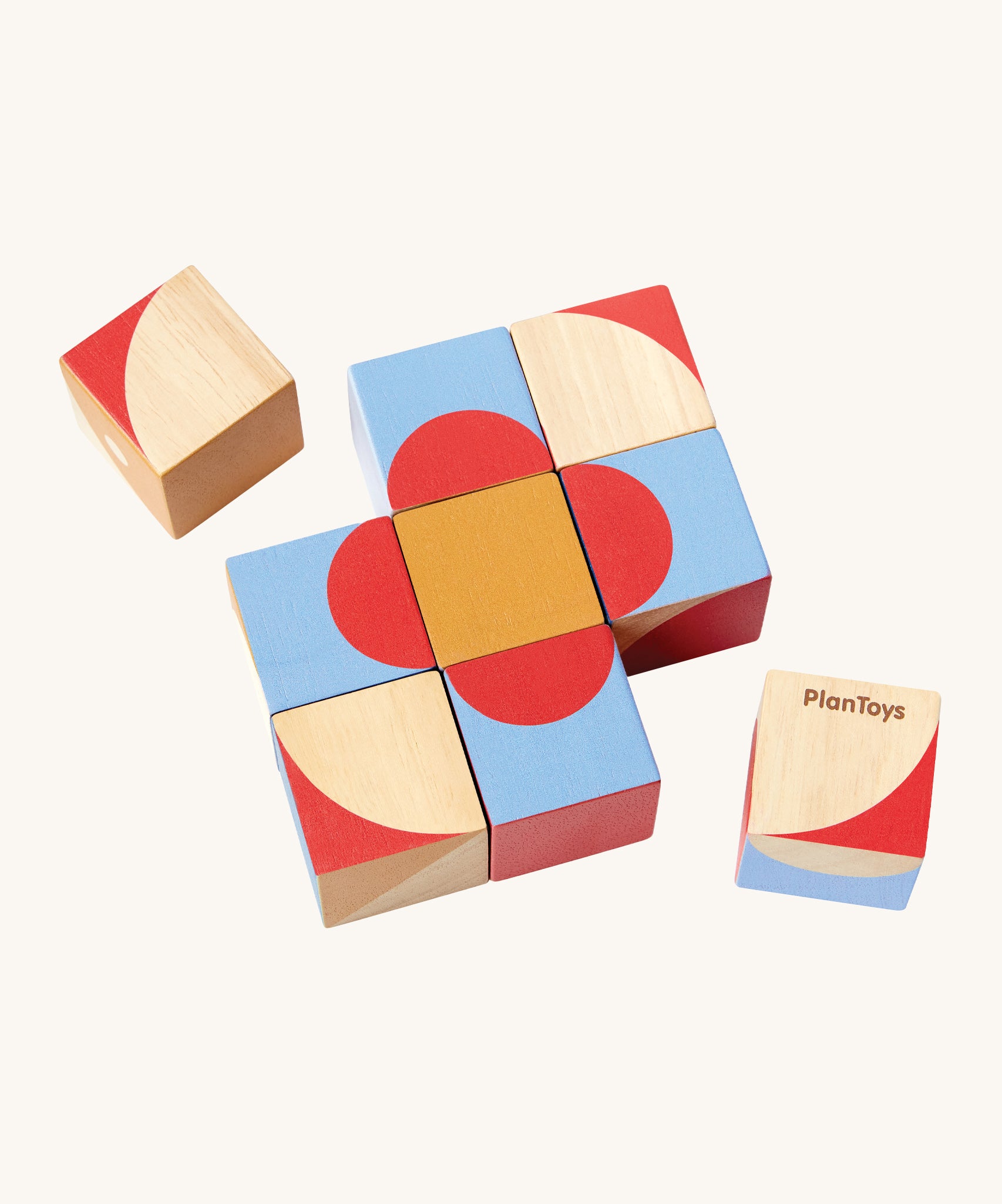 The PlanToys Geo Pattern Cubes are a fantastic STEM toy for children. The image shows 3 cubes each with a geometric petterns in the colours red, blue, orange, white and natural wood. The images shows 7 blocks together in the center with a block either side, on a cream background