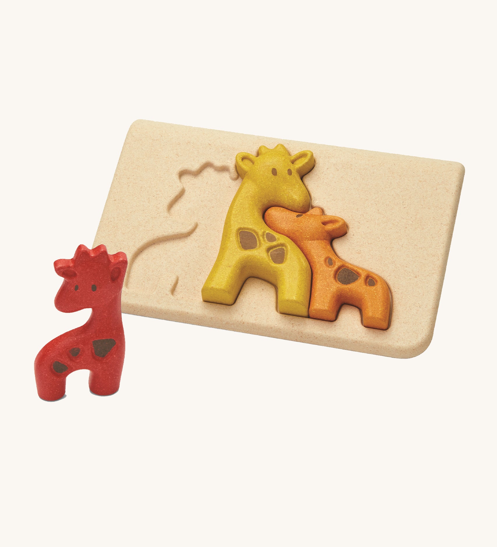 The PlanToys Giraffe Puzzle is an adorable puzzle for little ones. The set comes with a red, a yellow and an orange giraffe which when put together in the puzzle board, look like they're all nuzzling together. The image is on a cream background