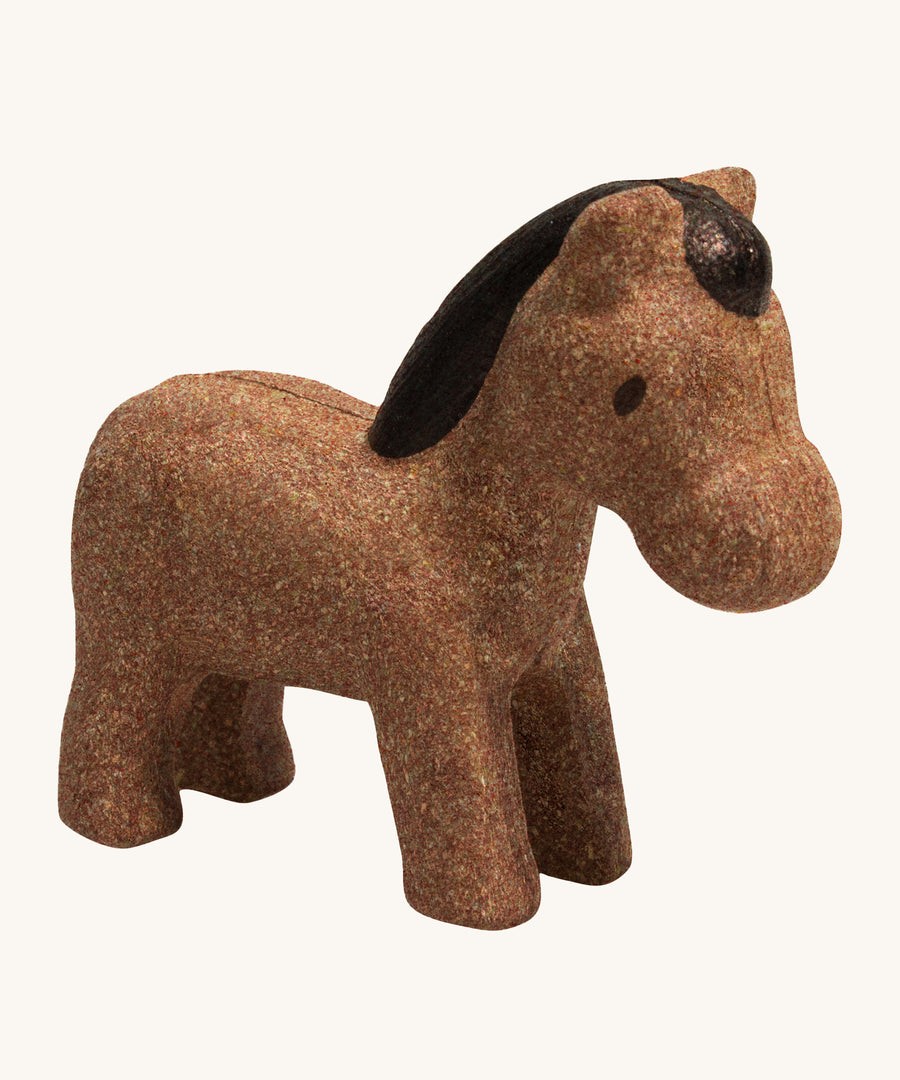 The PlanToys Horse is an adorable farm yard toy for little ones. Made from PlanWood, this horse is brown with a dark brown mane, and is on a cream background