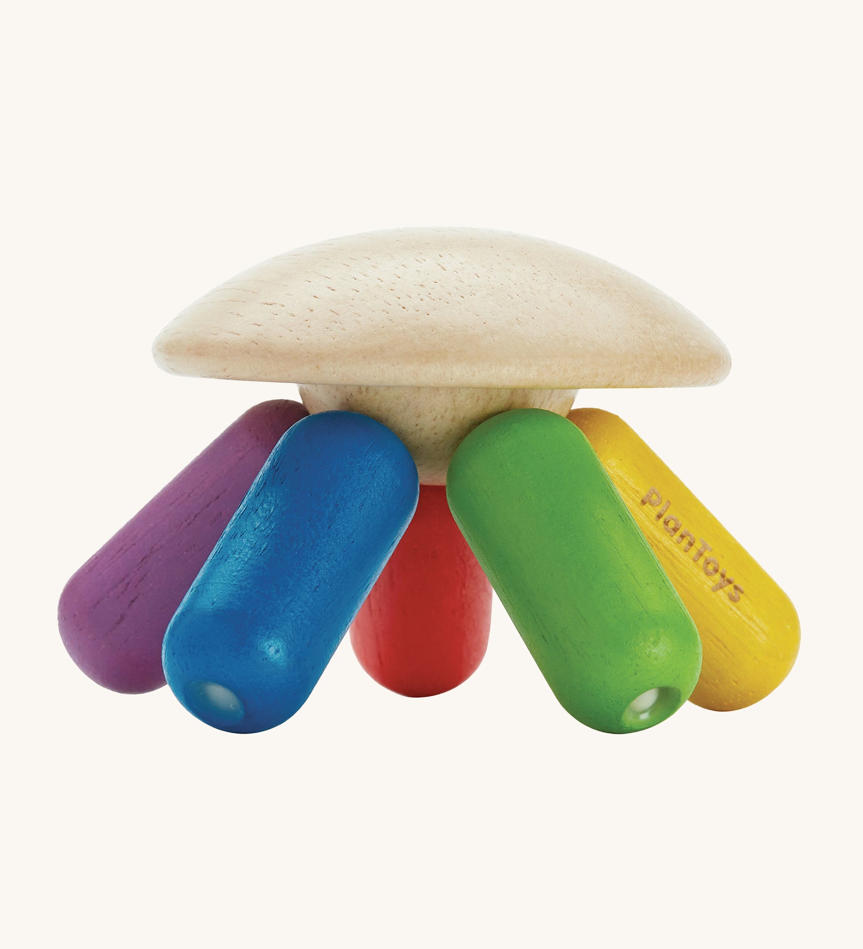 PlanToys plastic-free wooden flexi jellyfish shaped baby sensory and rattle toy in rainbow colours of, green, yellow, red, purple and blue, on a cream background