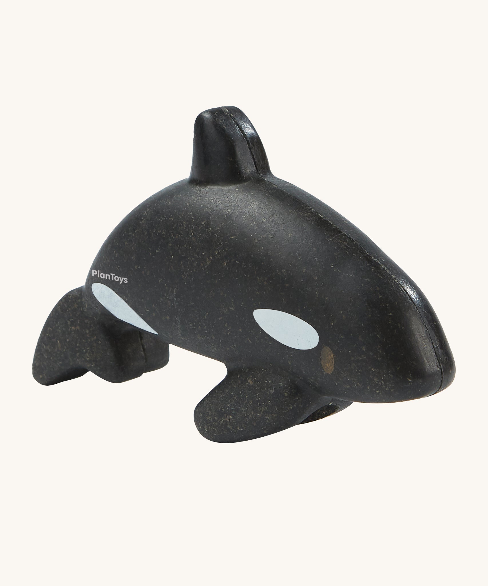 The PlanToys Orca is an adorable sea life toy for little ones. Made from PlanWood, this orca is black with white spots, and is on a cream background