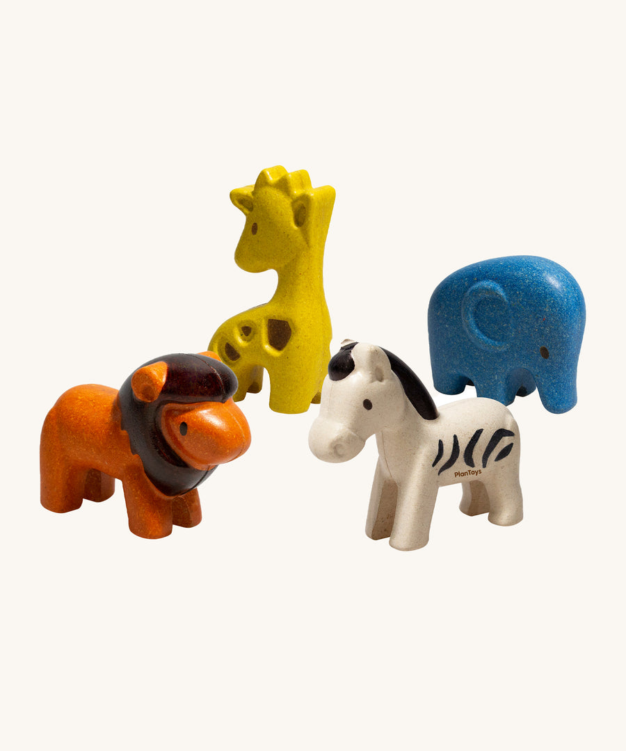 The PlanToys Wild Animals Set comes with four, adorable animal figures which include an orange lion, a yellow giraffe, a blue elephant and a white zebra with black stripes. The image is on a cream background