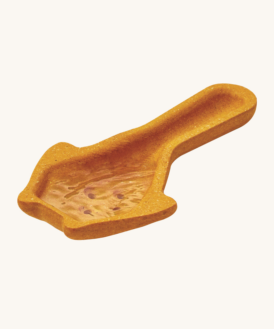 The PlanToys yellow scoop has small holes on the base of the scoop to allow for water to pour through. In the image the scoop is filled with water 