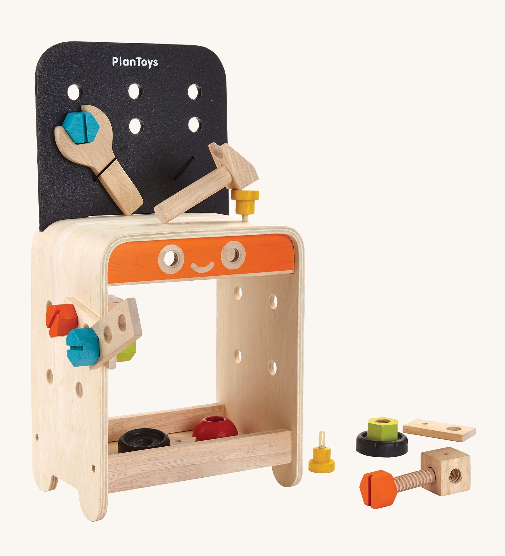 PlanToys Workbench is a great STEM activity toy for little ones. The work bench comes with various wooden screws, nuts, bolts, blocks, a spanner, and a hammer which can all be screwed or hammered onto the work bench, and can be stored in a space underneath the workbench. The image is on a cream background