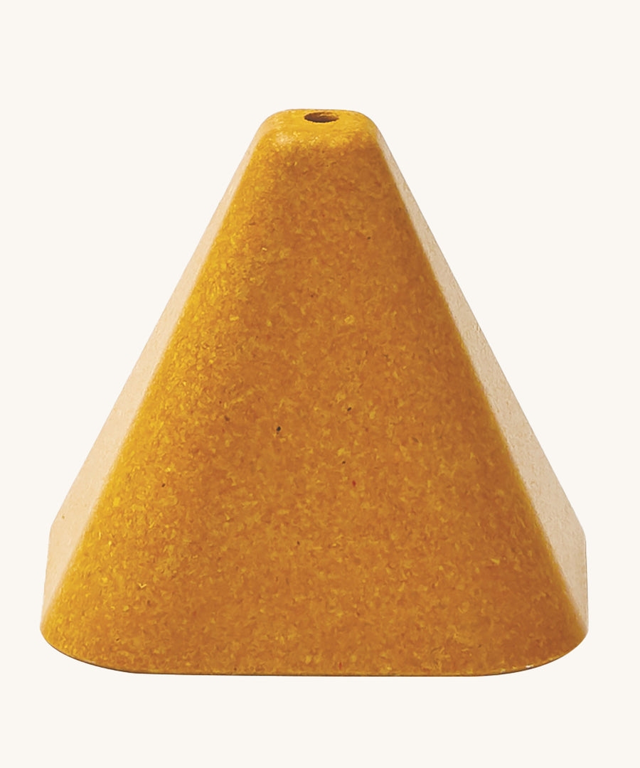 The yellow triangle block from the PlanToys Creative Sand Play, with a ole in the top to allow for water to be poured through