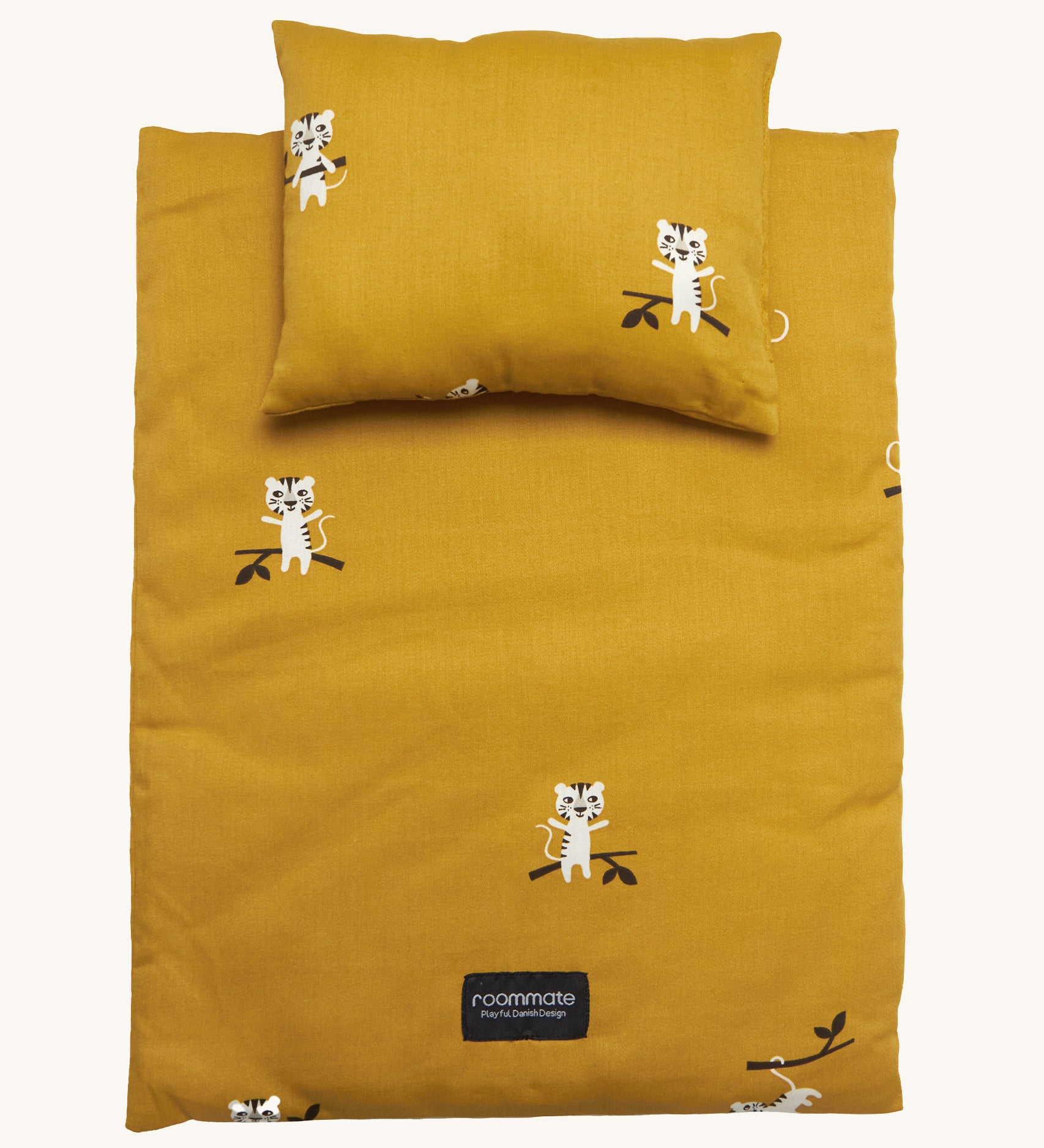 Roommate Doll Bedding Set - Tiger, in a mustard yellow colour, with adorable tiger print. The image shows a blanket and a pillow set on a cream background