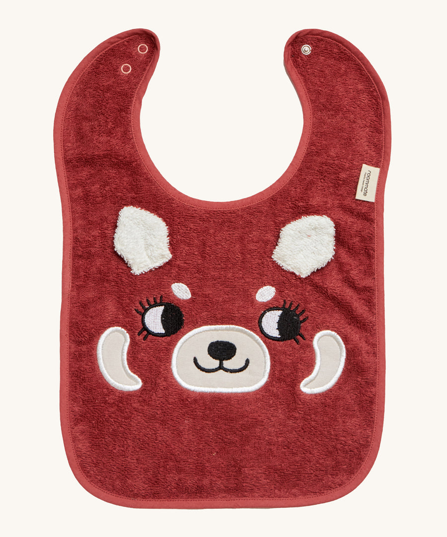 Roommate Organic Cotton Baby Bib - Red Panda, is a flannel style bib with a cute red panda face, interactive panda ears, and a metal popper fastener to close the bib behind the neck. The image is on a cream background