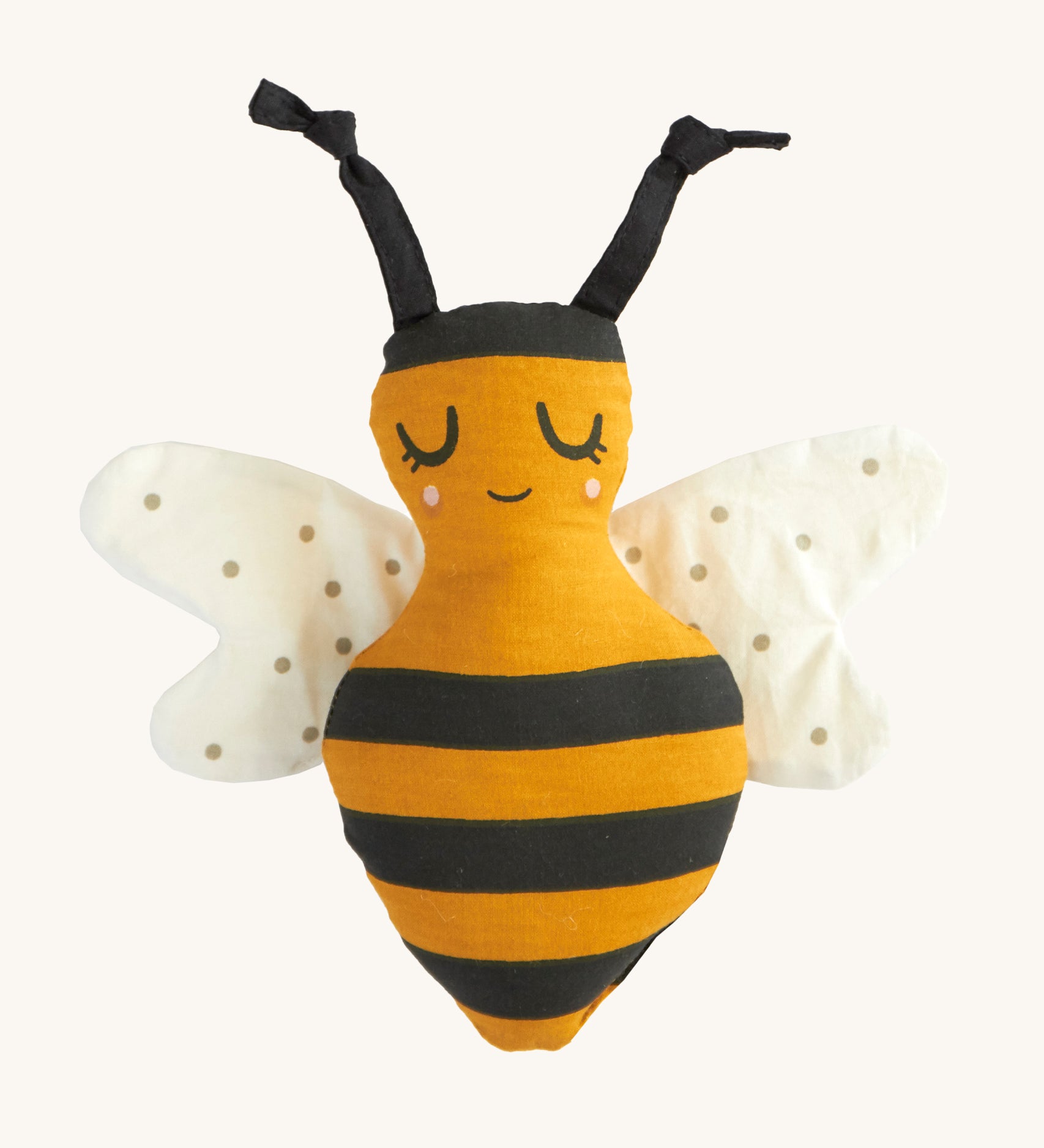 Roommate organic cotton soft childrens rattle bee toy on a cream background