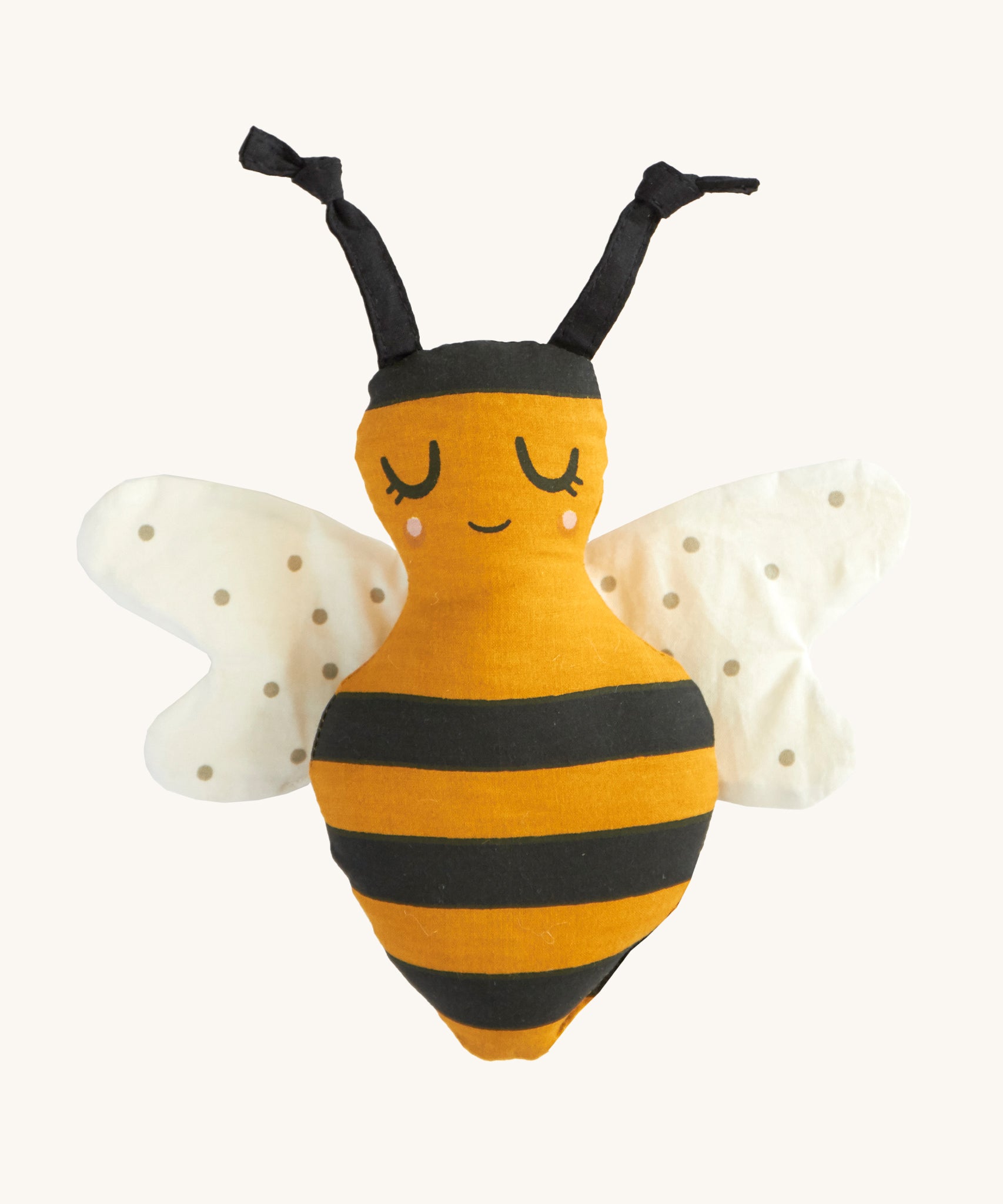 Roommate organic cotton soft childrens rattle bee toy on a cream background