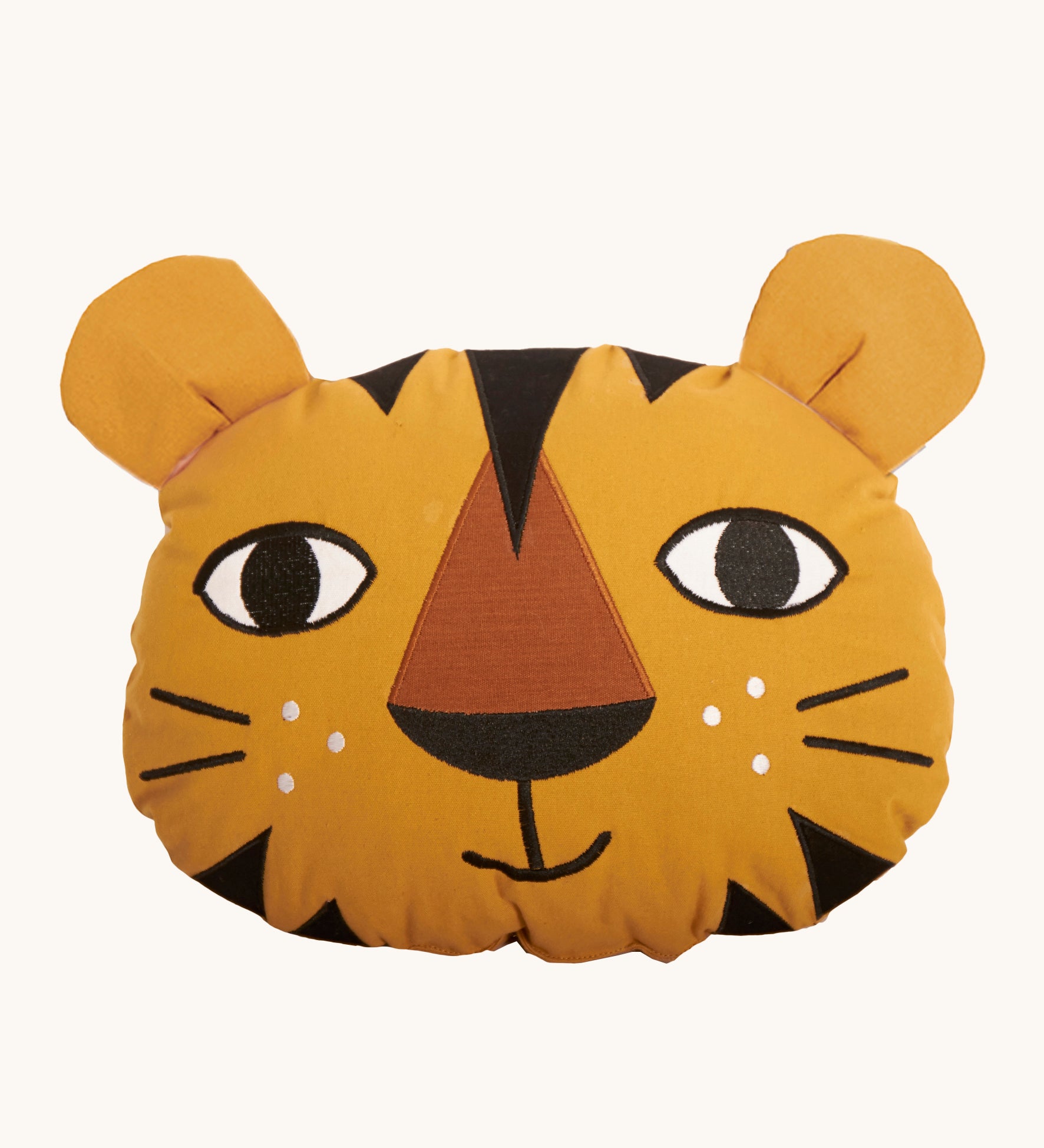 Roommate Tiger Cushion made from organic cotton on a cream background. The tiger cushion has embroidered features and is yellow with black stripes on its head and chin area