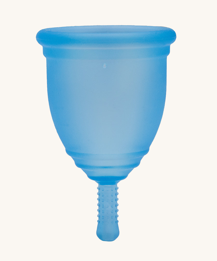 Ruby Cup Menstrual Cup in blue silicone, on a cream background