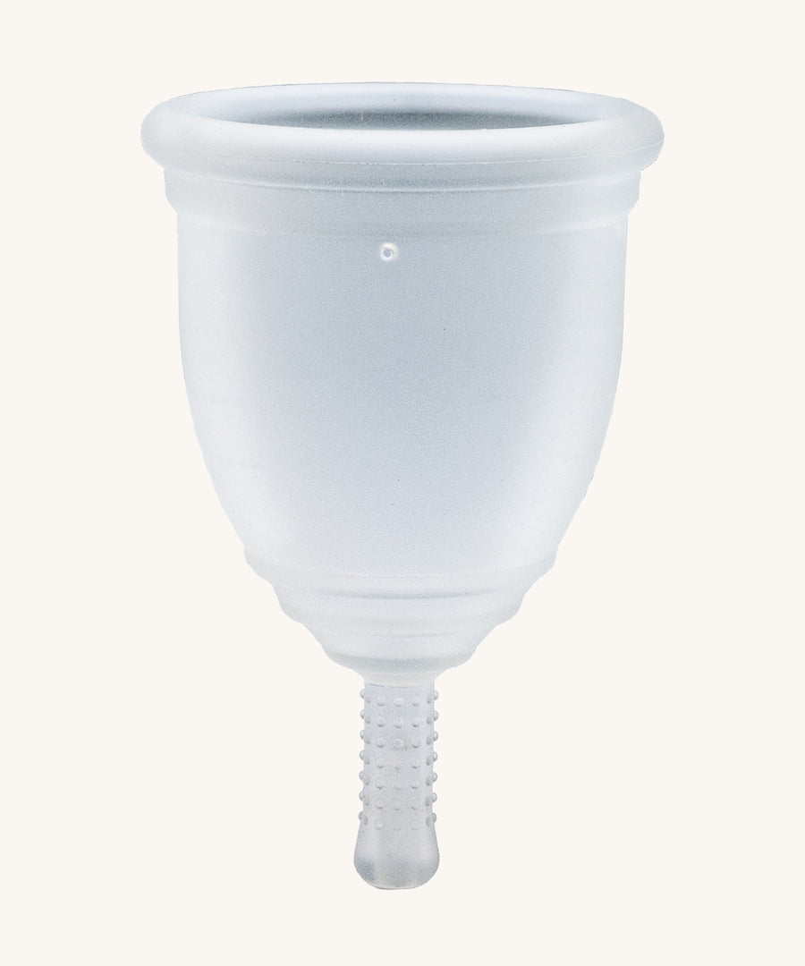 Ruby Cup Menstrual Cup in clear silicone, on a cream background