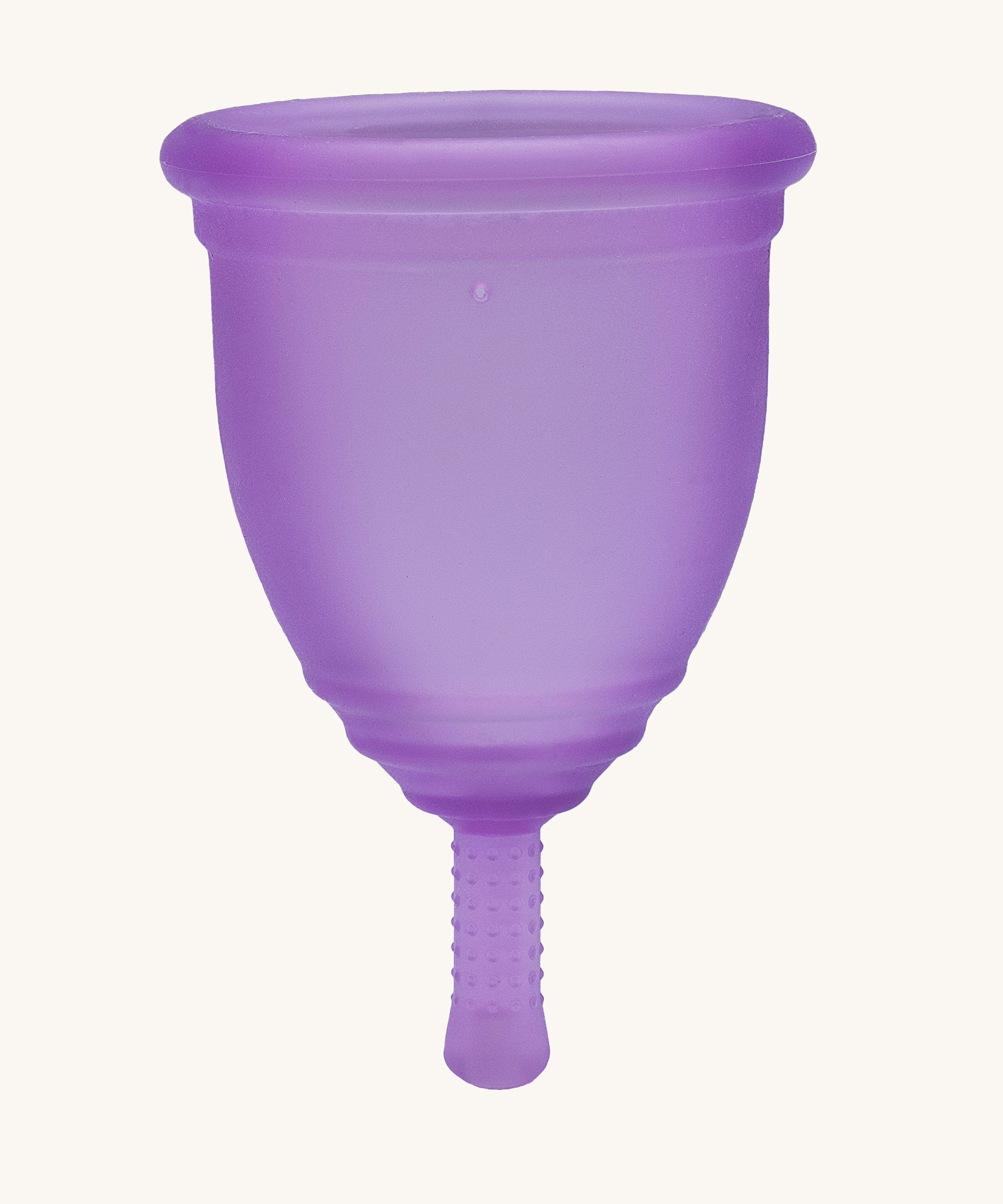 Ruby Cup Menstrual Cup in purple silicone, on a cream background