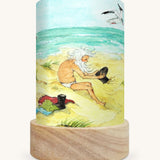 The Sea Gnome illustration by Eentje Van Margo sat in a Toverlux Magic Lantern base, on a cream background