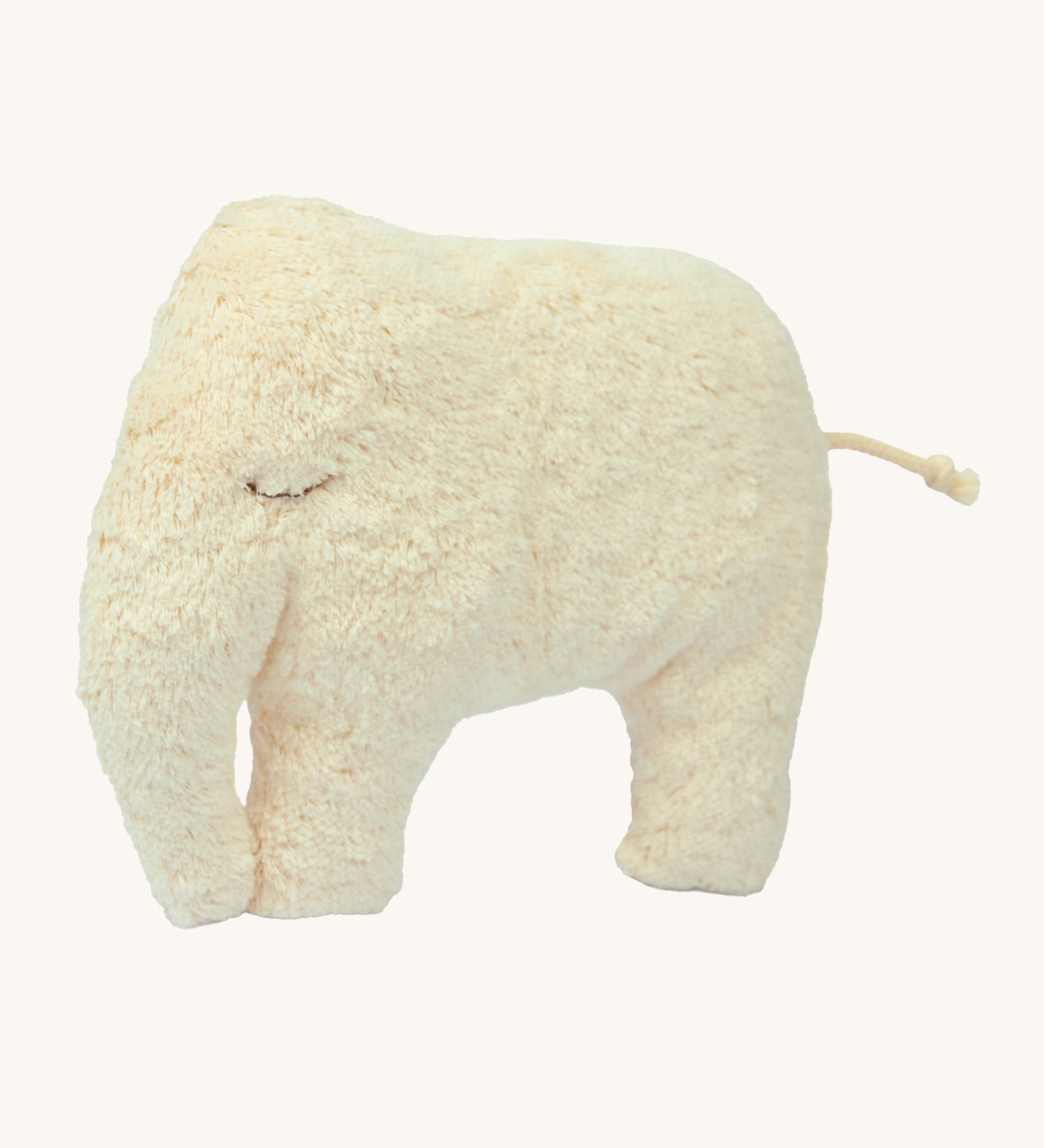 Senger Cuddly Animal Cushion - Elephant is a duel sided cushion with the image showing the fluffy, sleepy cream elephant side, and on the revers is a cotton check fabric