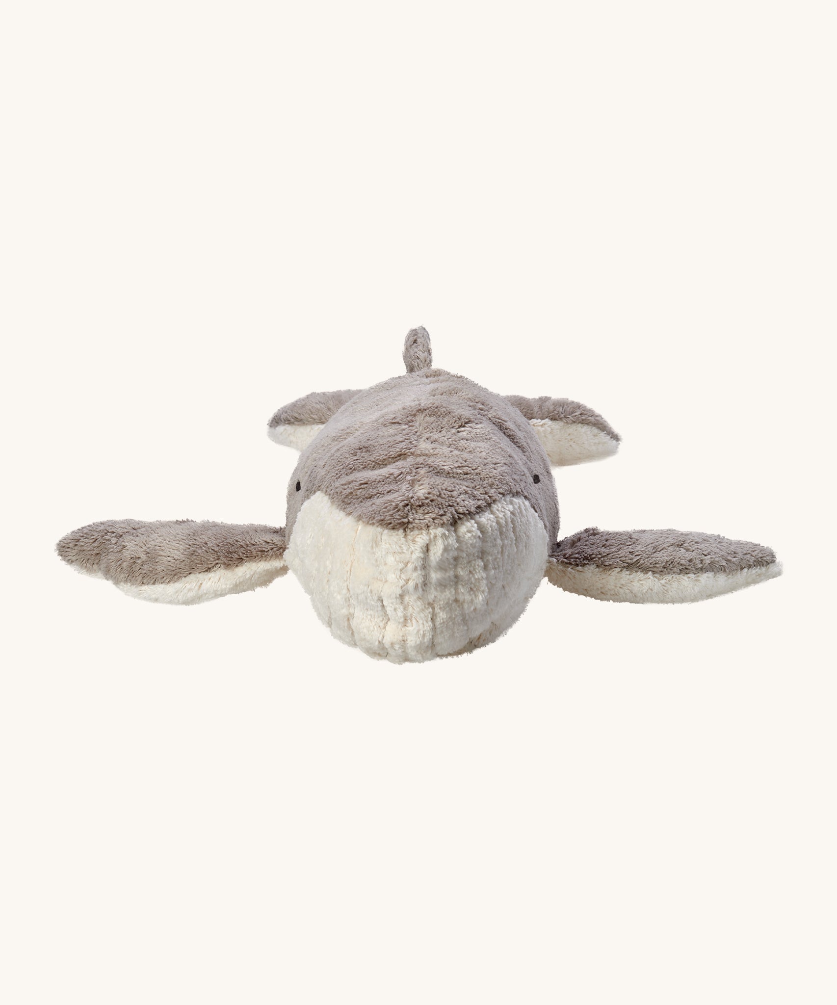 A front view of the Senger Large Cuddly Whale, showing a close up of the white mouth part, and showing the fins and tail. The image is on a cream background