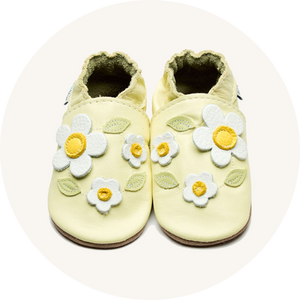 Inch Blue floral shoes on cream background to represent baby shoes at Babipur.