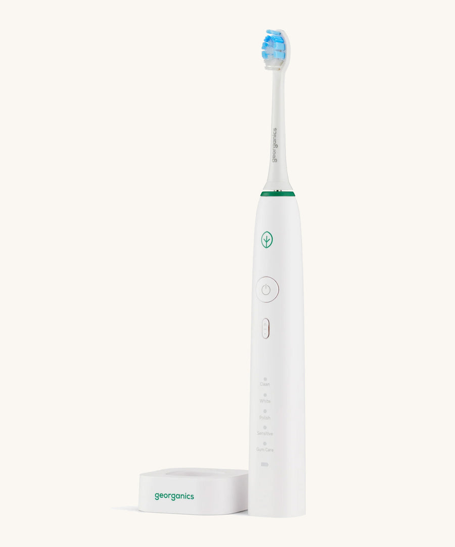 The Georganics toothbrush off the charging stand 