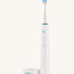 The Georganics toothbrush off the charging stand 