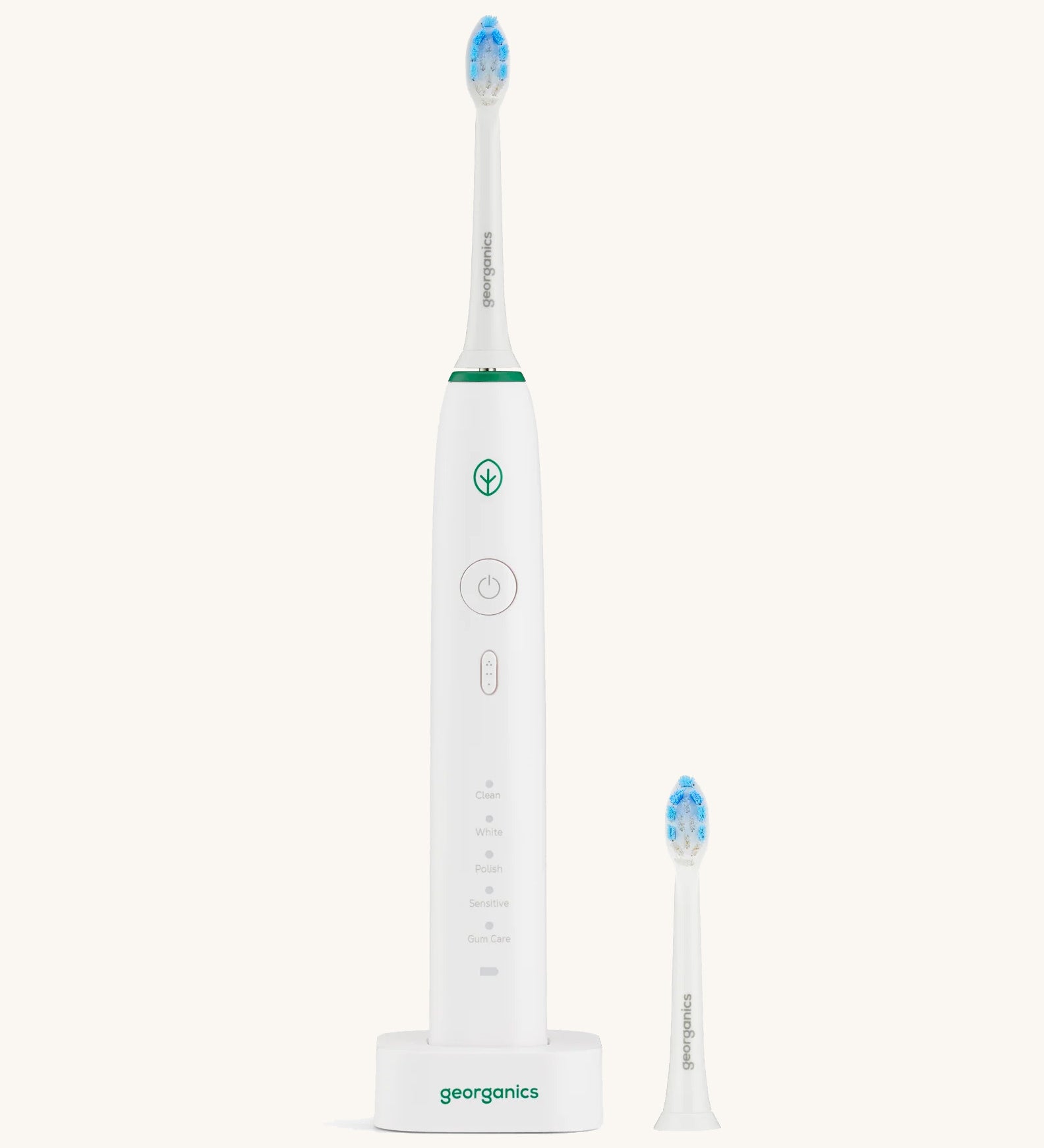 A Georganics sonic toothbrush set with the 50000spm replacement head on a cream background