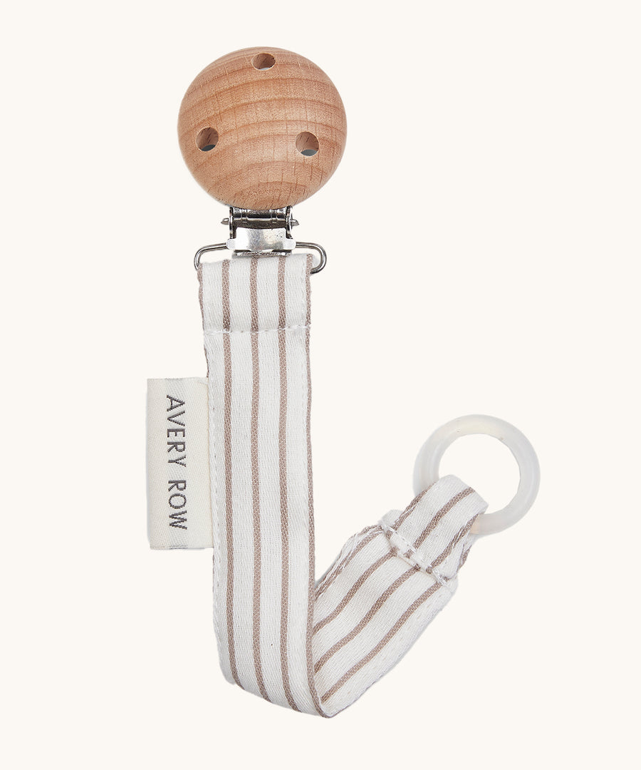 Avery Row Pacifier Holder - Stripe, showing the silicone ring and wooden clip