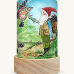 The Summer Gnome illustration by Eentje Van Margo sat in a Toverlux Magic Lantern base, on a cream background