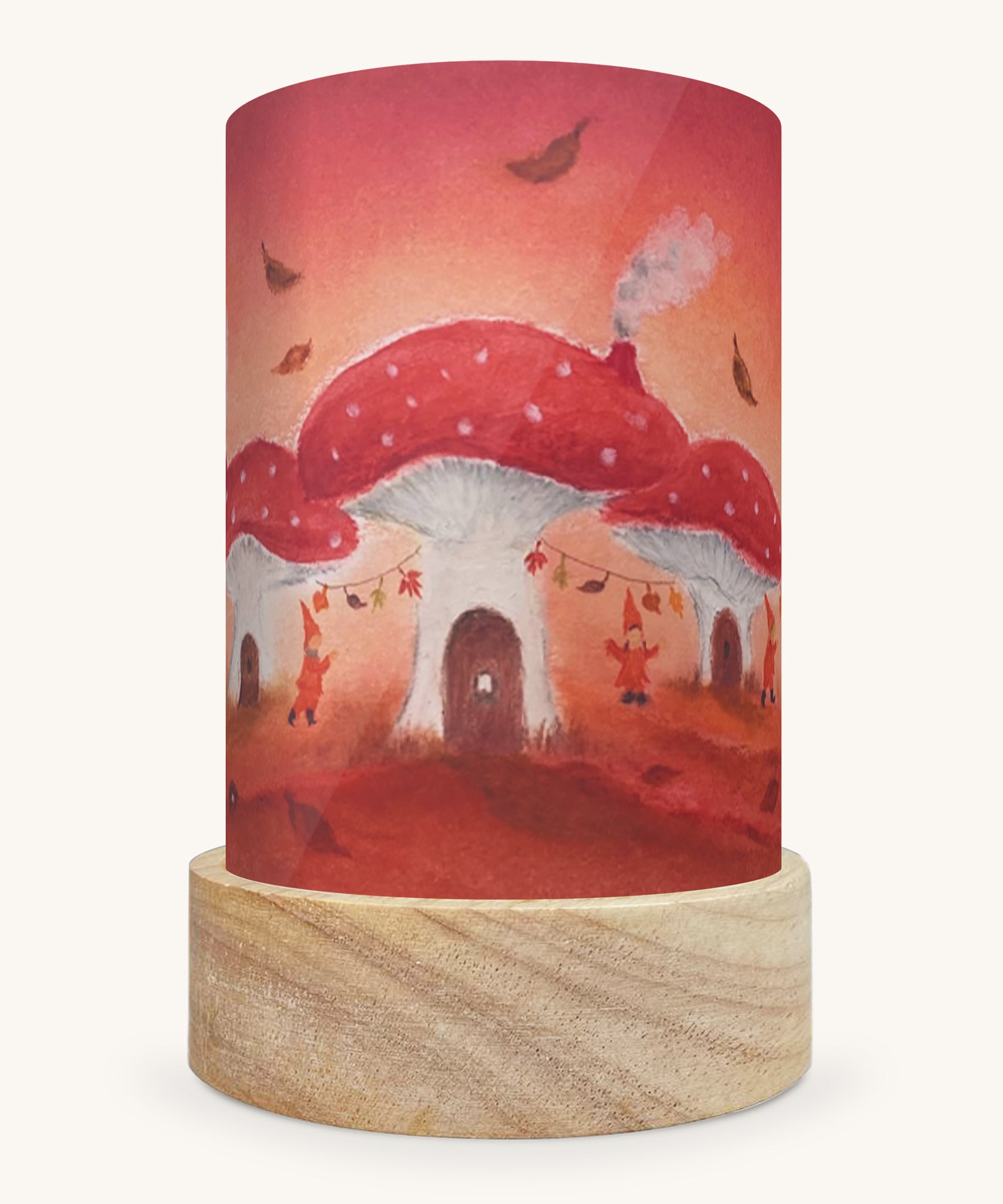 The Toadstool Village illustration by Baukje Exler sat in a Toverlux Magic Lantern base, on a cream background