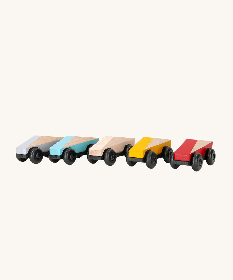 The Bajo Tobe Poly cars, in a row on a cream background