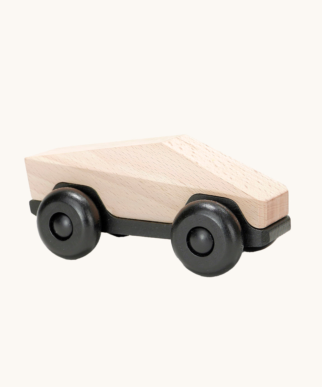 Tobe Poly Car in natural wood and black, on a cream background. The car is made from wood in a geometric shape to give a futuristic feel.