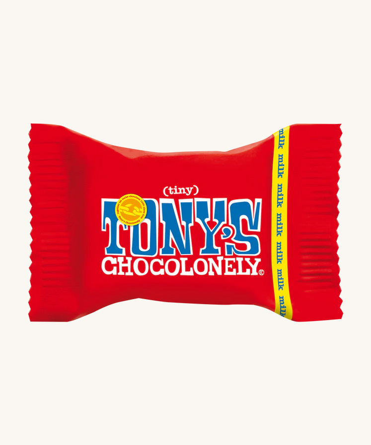 The Tony's Chocolonely Tiny Chocolate in its red wrapper, on a cream background