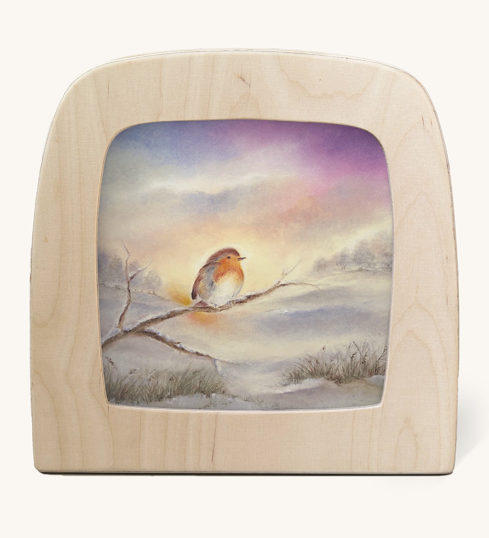 Winter Robin Toverlux Magic Lamp Silhouette - Artwork By Baukje Exler. A lovely little robin is sat on a snowy covered tree branch, with a snowy woodland background in the illustration, in tones of white, grey and purple. The image is on a cream background