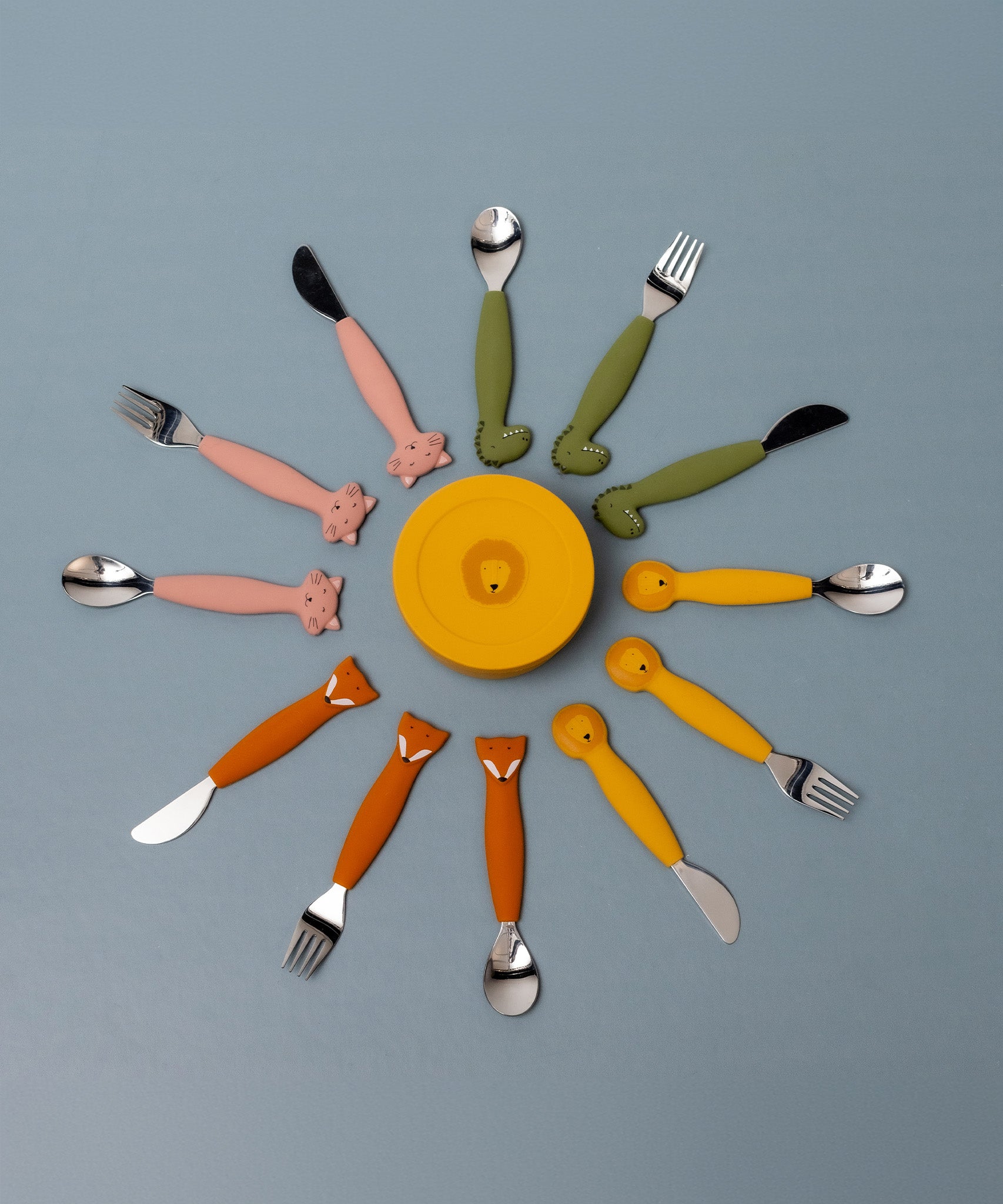 Trixie Animal Friends Silicone Cutlery Set - 3 Pack, spoon, fork and knife arranged in a circle showing the different animal characters.