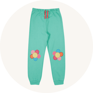 Frugi flower joggers on cream background to represent children's trousers at Babipur.