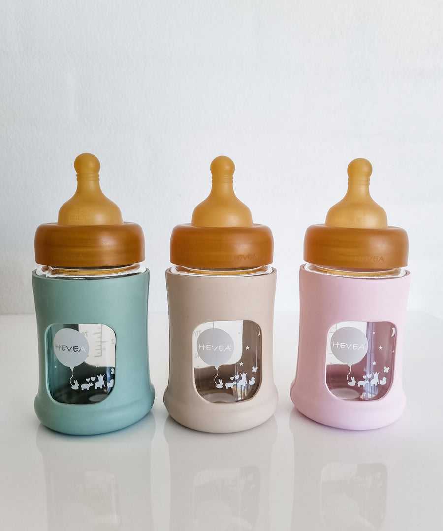 Hevea Glass Baby Bottle Wide Neck With Rubber Sleeve - 150ml in Seafoam Blue, Sand and Powder Pink