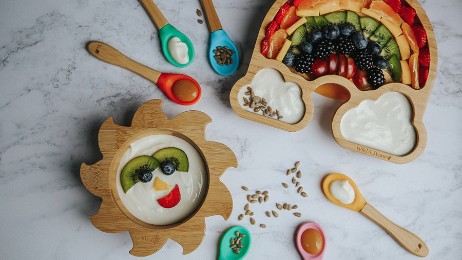 Wild and Stone baby weaning plate filled with fruit and yoghurt