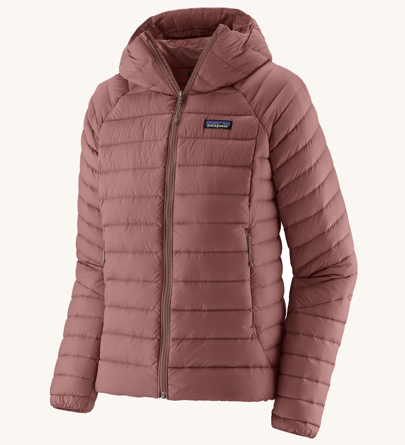 Patagonia Women's Down Sweater Hoody - Dulse Mauve. A light weight  coat in a light pink colour, on a cream background