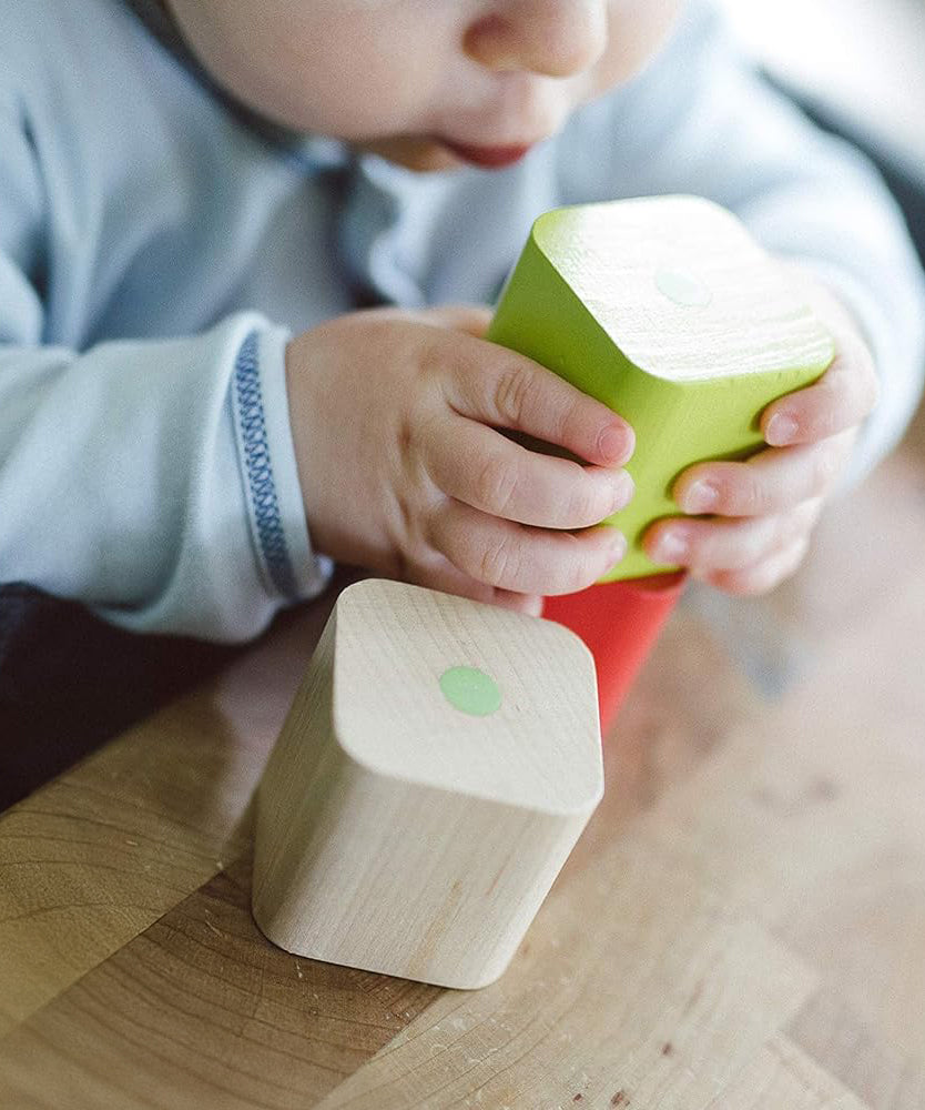 A closer image of the Tegu wooden magnetic blocks showing the natural wood grain