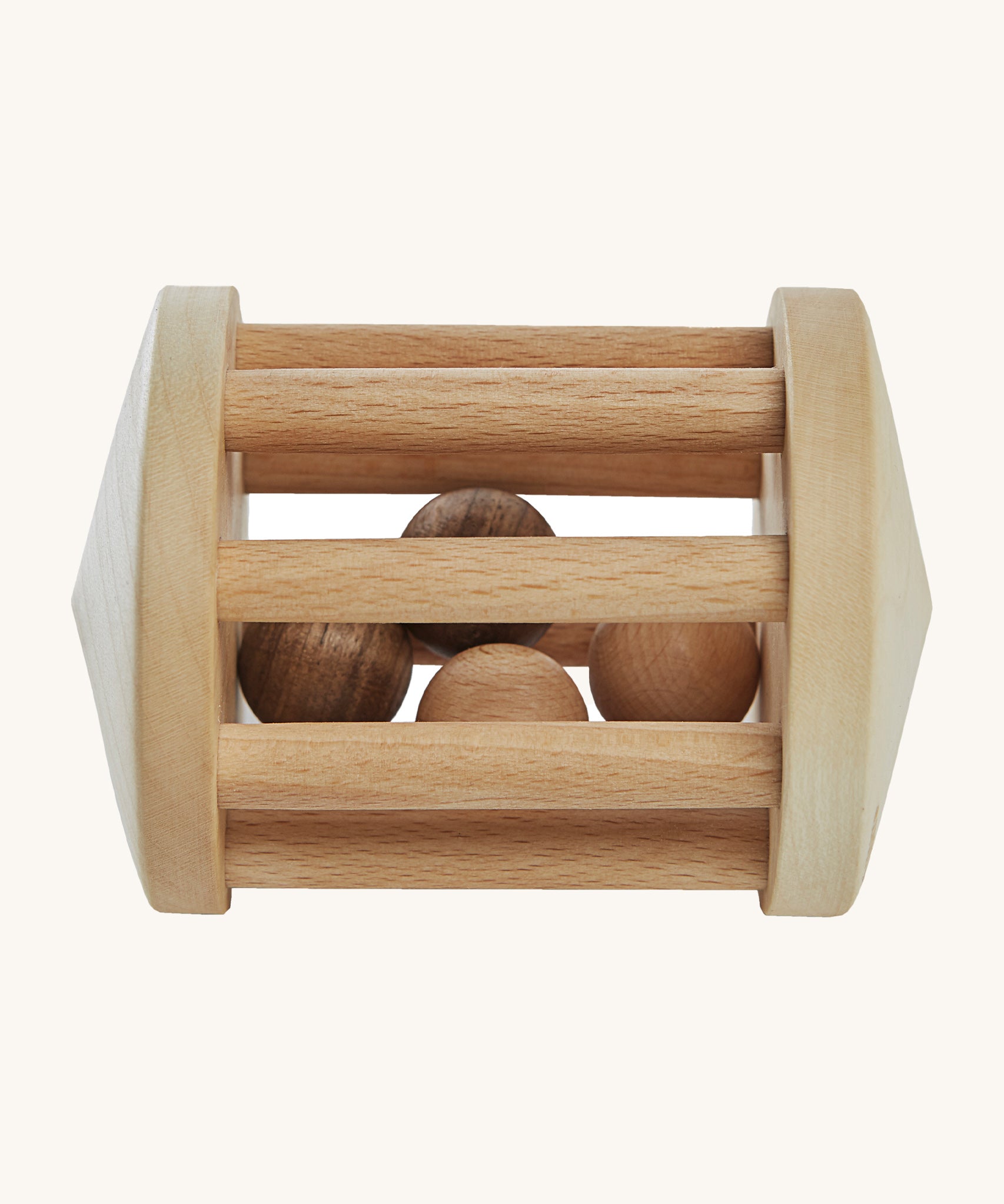 Wooden Story Turtle Dove Rattle, is a beautiful, wooden baby rattle toy. The wooden balls inside the rattle create a wonderful sensory experience for anyone playing with it. The image is on a cream background