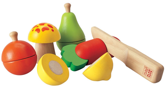 The PlanToys wooden fruit and veggie set for the play kitchen includes a pear