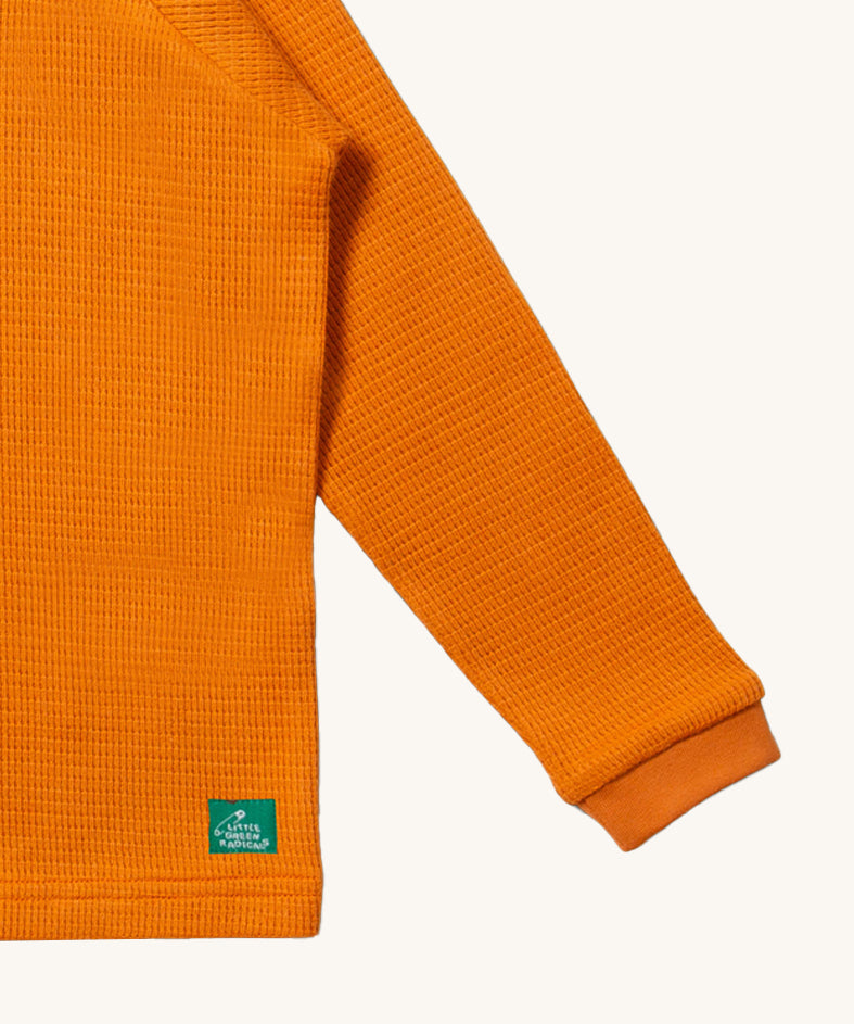 A closer look at the waffle texture fabric of the LGR Long Sleeve Waffle Top - Golden Ochre