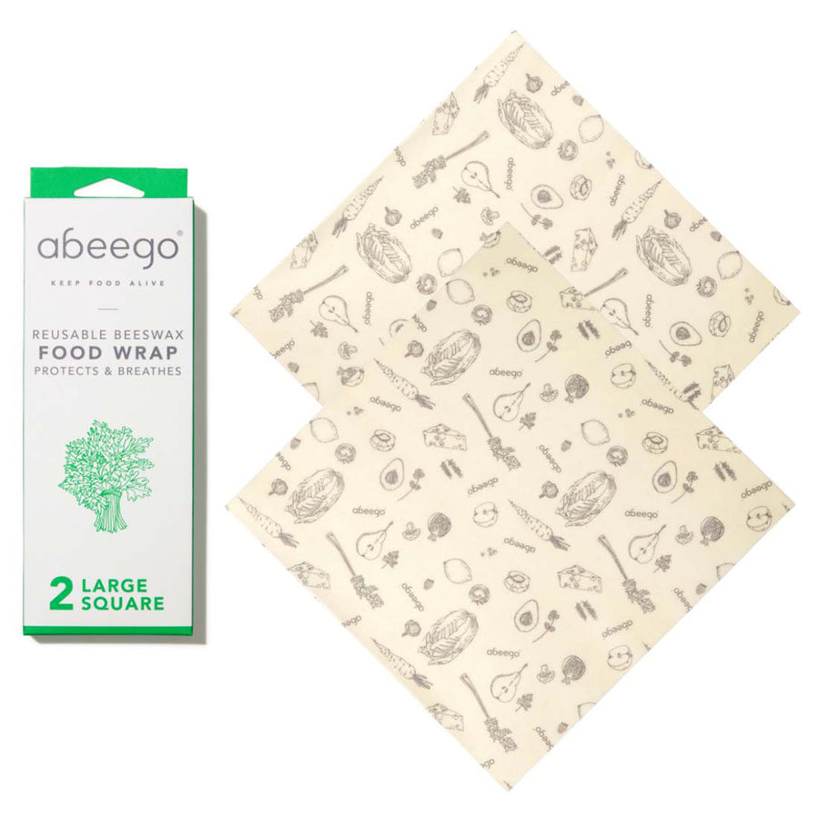 Abeego 2 large square beeswax food wraps laid out on a white background next to their packaging