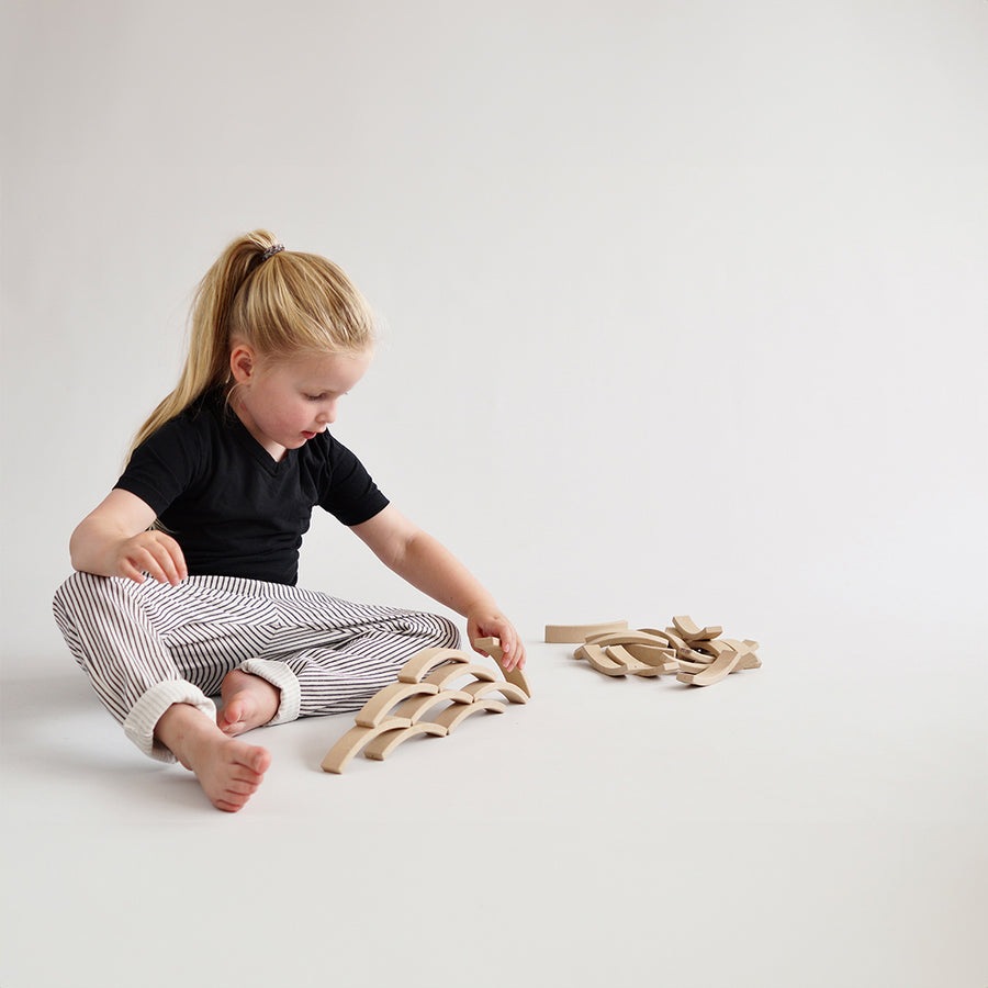 Picture of a child stacking the Abel Mini Re-Wood blocks.