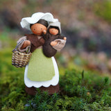 Close up of the Ambrosius eco-friendly mother earth and baby felt dolls stood on some moss