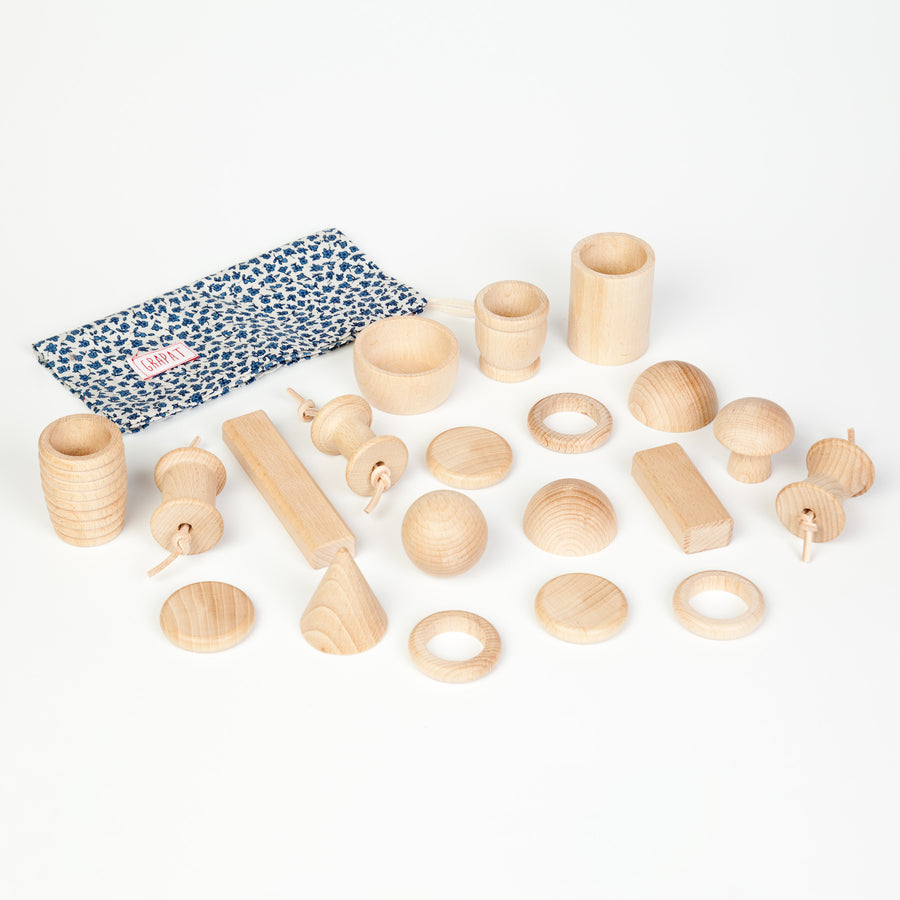 3 natural wood bobbins in 3 different spool shapes for heuristic play. Suitable from 10 months+. White background.