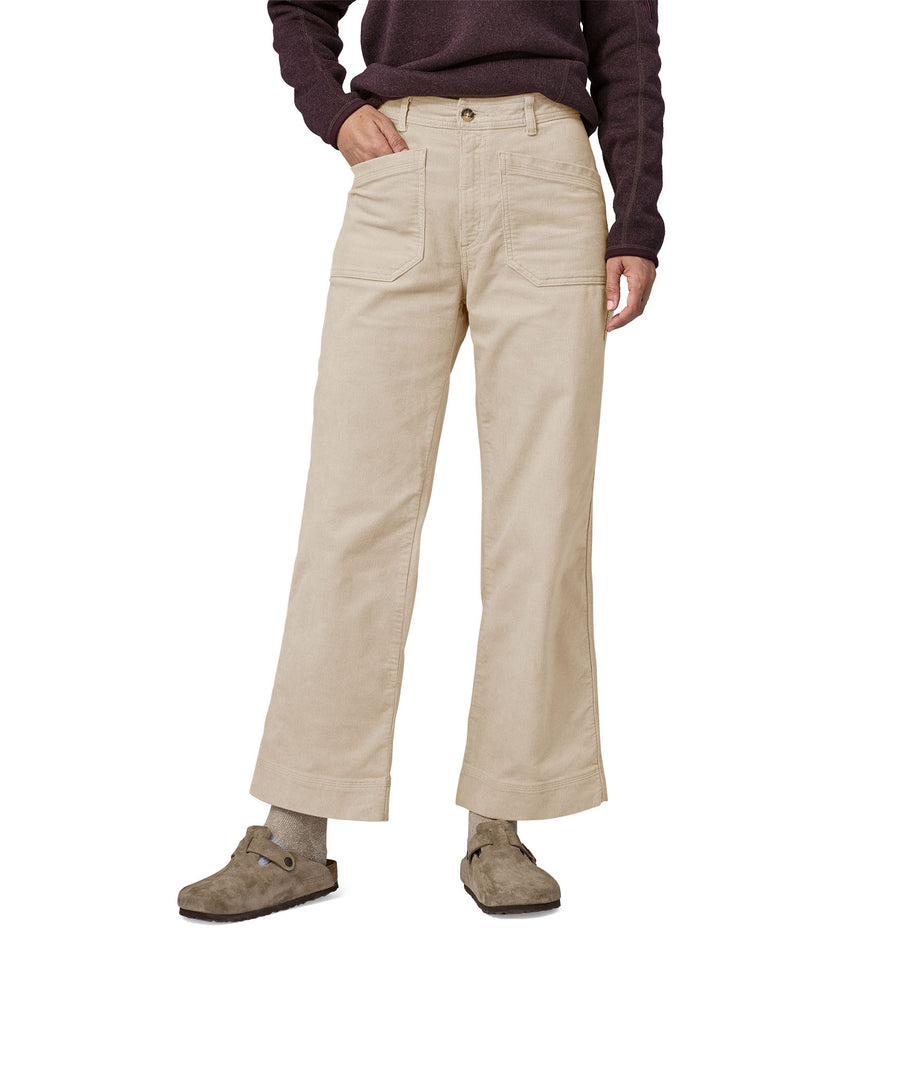 A close up of a woman wearing the Patagonia Women's Wide Leg Cord Pants in a pumice colour showing the front