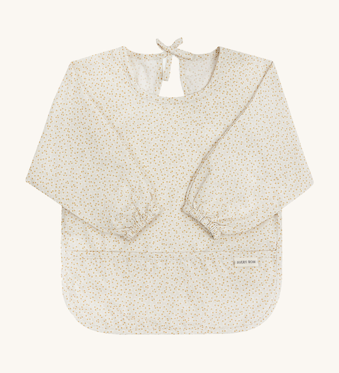 A light Avery row long sleeve bib with a daisy design on the front on a cream background.