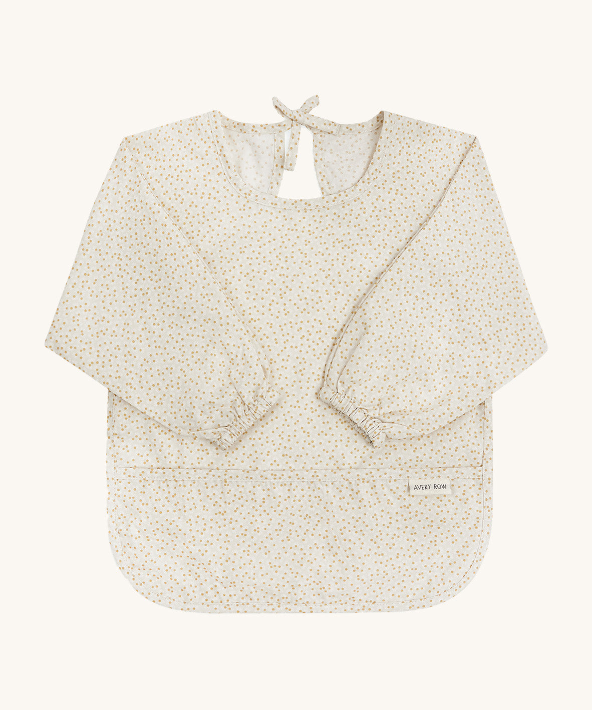 A light Avery row long sleeve bib with a daisy design on the front on a cream background.