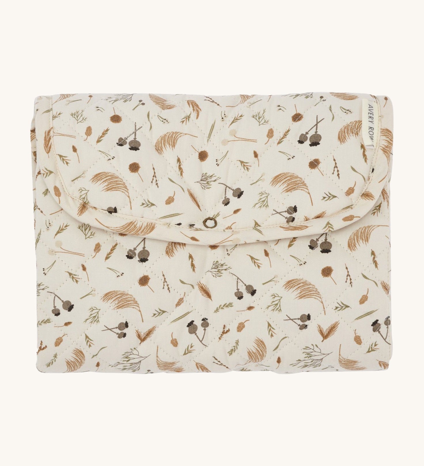 A light soft cream Avery Row travel changing mat with a grassland design on a cream background.